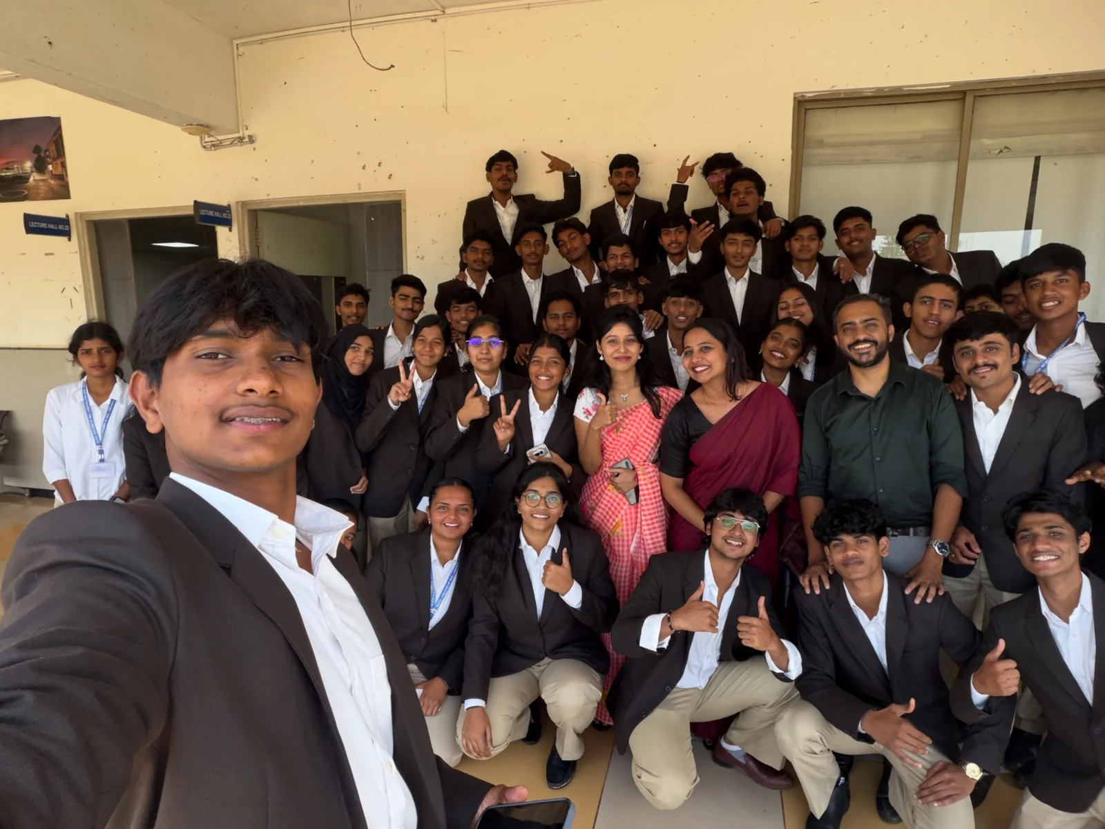 Students and an Upskill trainer posing together after an AI skills session.