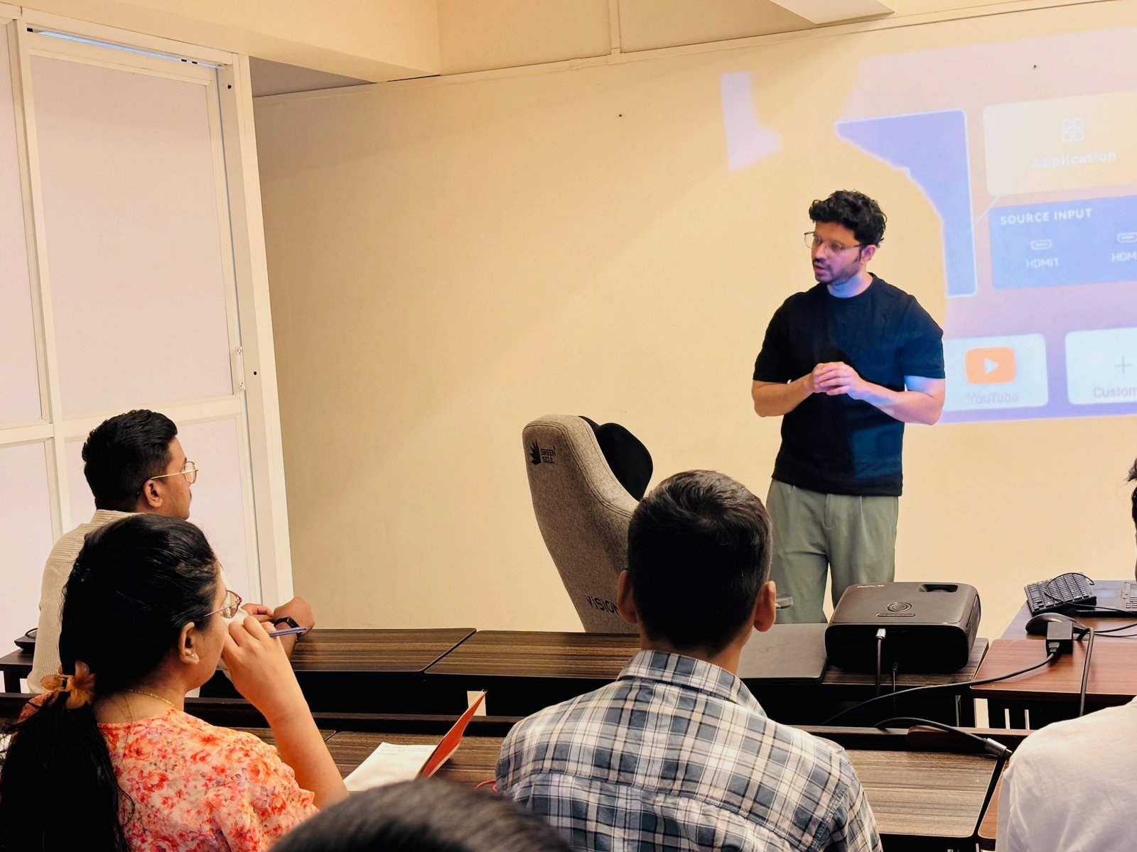 A trainer leading a SAP and AI workshop with participants at Upskill Digital Academy.